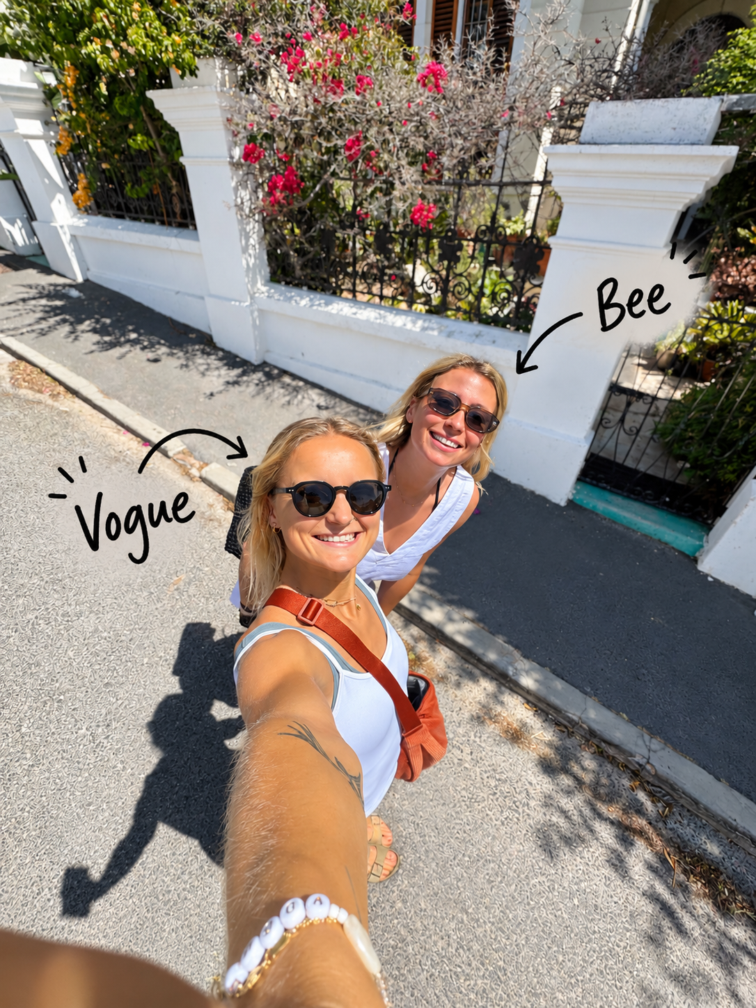 Vogue and Bee smiling together in Cape Town, with handwritten arrows showing who's who